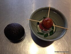 Avocado Seed suspended over water with tooth picks